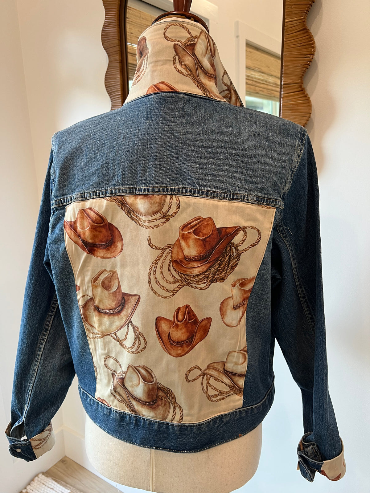 Back of Cowboy Hats & Ropes denim jacket