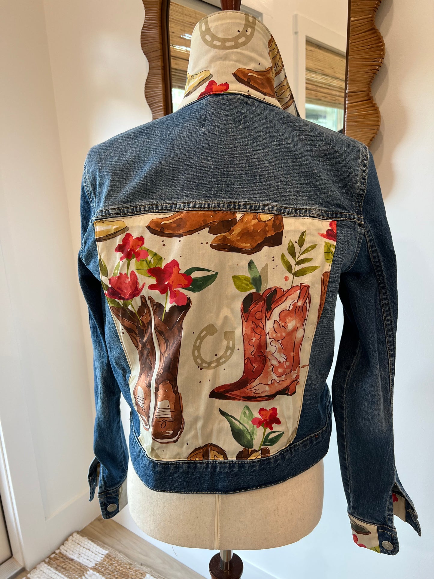 Back of Boots & Flowers denim jacket