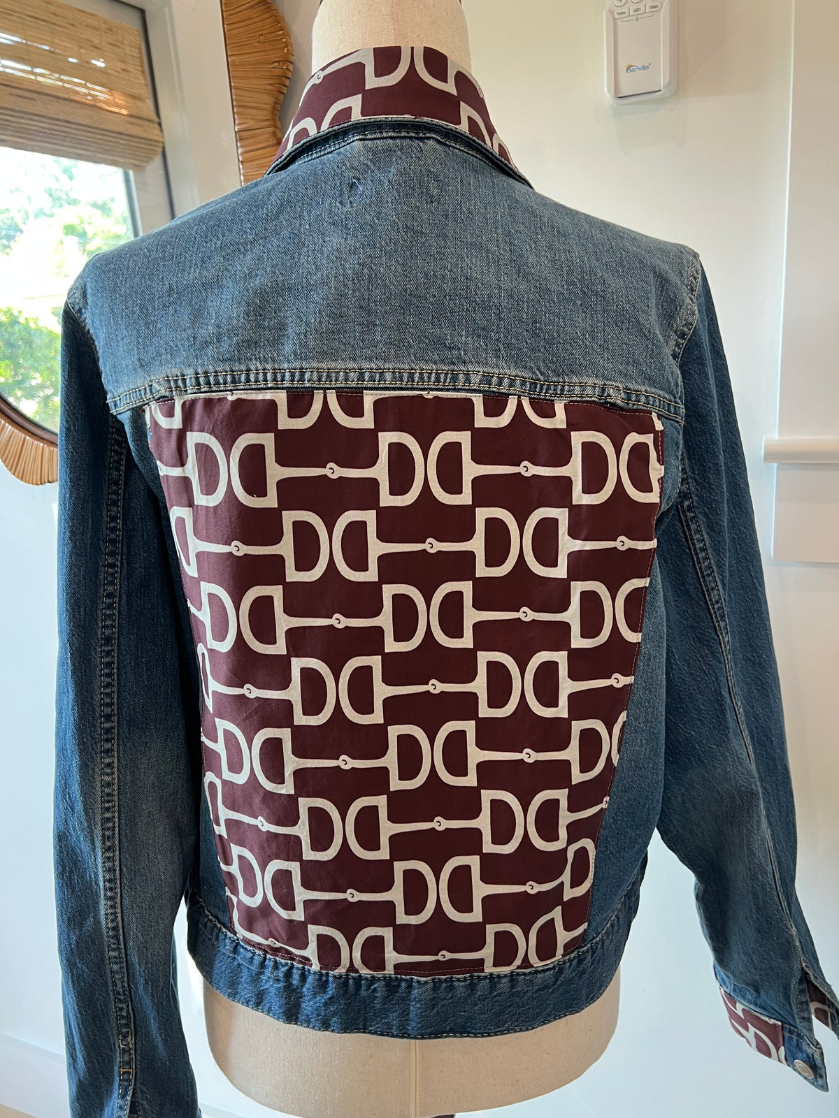 Back of Maroon & Grey Equestrian Denim Jacket with grey horsebit print on a maroon cotton panel