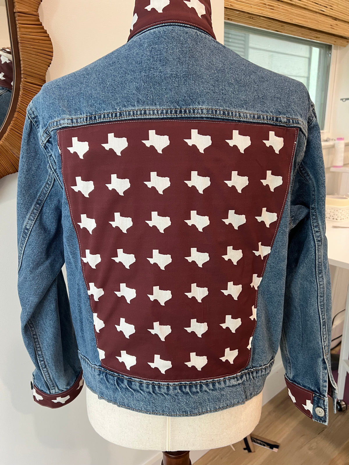 Original back of Maroon Texas Denim Jacket with white Texas silhouettes on maroon cotton